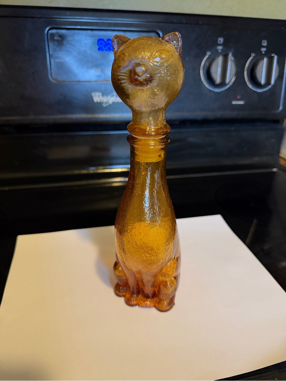 Vintage amber Empoli Cat bottle, 9 inch tall, chipped foot.